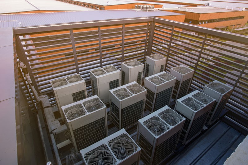Air Condensing Unit on the Rooftop — Air Conditioning Professionals in Forster, NSW