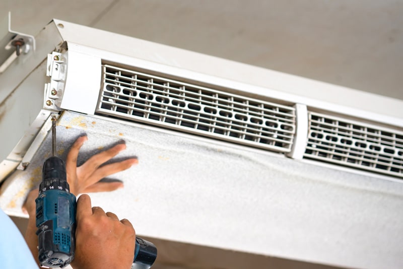 Technician Open Air Condition for Clean and Repair — Air Conditioning Professionals in Forster, NSW