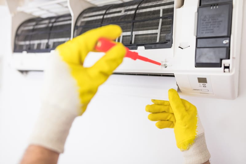 Fixing AC Unit and Cleaning — Air Conditioning Professionals in Taree, NSW